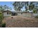Large backyard showcasing potential for a garden, play area, or an outdoor retreat at 306 S Highland Ave, Clearwater, FL 33755
