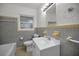 Classic bathroom with a tiled shower, a toilet, and a vanity with an integrated sink at 306 S Highland Ave, Clearwater, FL 33755