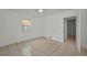 Comfortable bedroom featuring a ceiling fan, tile flooring, and a convenient entrance at 306 S Highland Ave, Clearwater, FL 33755