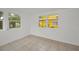 Bonus room showcasing white walls, tile floors, and a window to allow natural lighting into the home at 306 S Highland Ave, Clearwater, FL 33755