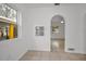 View of a bright, bonus room with natural light, tile floor, and open access to other parts of the home at 306 S Highland Ave, Clearwater, FL 33755