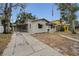 Charming single-Gathering home with a carport and driveway, perfect for easy parking at 306 S Highland Ave, Clearwater, FL 33755