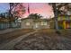 Charming single-story home features a well-kept lawn, mature trees, and welcoming front entrance at 306 S Highland Ave, Clearwater, FL 33755