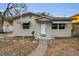 Inviting front exterior with a walkway, awnings, and decorative door frame at 306 S Highland Ave, Clearwater, FL 33755