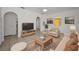 Comfortable living room with tiled floors, neutral furniture, and bright natural light provides a welcoming space at 306 S Highland Ave, Clearwater, FL 33755