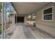 Open patio with stone floor, structural posts, and a view of the surrounding property at 306 S Highland Ave, Clearwater, FL 33755