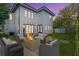 Rear view of a modern home featuring an outdoor seating area with a fire pit at 3175 10Th N Ave, St Petersburg, FL 33713
