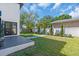 Landscaped backyard with a well-maintained lawn and a stepping stone path at 3175 10Th N Ave, St Petersburg, FL 33713