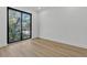 Bright bedroom with a large window and hardwood floors, offering a minimalist design at 3175 10Th N Ave, St Petersburg, FL 33713