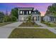 Beautifully landscaped modern home with clean lines, manicured lawn, and a spacious driveway at 3175 10Th N Ave, St Petersburg, FL 33713