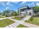 Contemporary home boasts modern design, a meticulously landscaped yard, and inviting walkway at 3175 10Th N Ave, St Petersburg, FL 33713