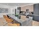 Modern kitchen boasts a large island with seating, stainless steel appliances, and stylish cabinetry at 3175 10Th N Ave, St Petersburg, FL 33713