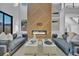 Bright living room featuring a modern fireplace, high ceilings, and comfortable seating arrangements at 3175 10Th N Ave, St Petersburg, FL 33713
