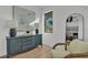 Chic living room featuring contemporary decor, a stylish blue cabinet, and natural light from the window at 3175 10Th N Ave, St Petersburg, FL 33713