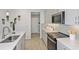 Kitchen featuring quartz countertops, stainless steel appliances, and modern backsplash at 3464 Timber Crossing Ave, Brandon, FL 33511