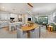 Open concept living and dining area with modern finishes and stainless steel appliances at 3464 Timber Crossing Ave, Brandon, FL 33511