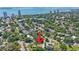 Wide aerial view shows a beautiful home with a treed lot in the middle of a gorgeous waterside community at 3501 S Drexel Ave, Tampa, FL 33629
