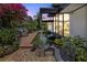 Zen-like backyard with water feature, lush garden, and outdoor seating area at 3501 S Drexel Ave, Tampa, FL 33629
