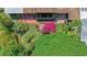 Aerial view of a private backyard featuring lush landscaping, a water feature, and patio seating at 3501 S Drexel Ave, Tampa, FL 33629