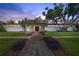 Stunning mid-century modern home featuring lush landscaping and a symmetrical facade at 3501 S Drexel Ave, Tampa, FL 33629