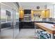 Updated kitchen with stainless appliances and an island with room for seating at 3501 S Drexel Ave, Tampa, FL 33629