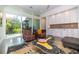 Bright living room features a wet bar, polished floors, and sliding glass doors to the outdoor living spaces at 3501 S Drexel Ave, Tampa, FL 33629