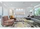 Open-concept living room with modern furniture and lots of natural light at 3501 S Drexel Ave, Tampa, FL 33629