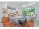 A bright main bedroom with a sitting area, natural light, and direct outdoor access at 3501 S Drexel Ave, Tampa, FL 33629