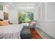 A bright main bedroom with a seating area, natural light, and large closet at 3501 S Drexel Ave, Tampa, FL 33629