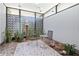Enclosed outdoor space with seating, sculpture, and tropical plants, offering a private and serene atmosphere at 3501 S Drexel Ave, Tampa, FL 33629