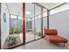 Relaxing outdoor area with gravel floor, tropical plants and seating, accessible from the bedroom through sliding glass doors at 3501 S Drexel Ave, Tampa, FL 33629