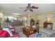 Inviting dining area with a rustic wooden table, bench seating, and a contemporary chandelier, perfect for Gathering gatherings at 3540 Cockatoo Dr, New Port Richey, FL 34652
