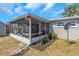 Screened lanai with patio furniture and backyard views at 3540 Cockatoo Dr, New Port Richey, FL 34652