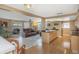 Open concept kitchen and living room area with stainless steel appliances and sliding glass doors at 3540 Cockatoo Dr, New Port Richey, FL 34652