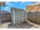 Exterior image of outdoor shed adjacent to fenced yard and patio area at 3540 Cockatoo Dr, New Port Richey, FL 34652
