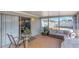 Relaxing sunroom with tile flooring, modern furniture, and access to the backyard at 3540 Cockatoo Dr, New Port Richey, FL 34652