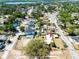A vibrant aerial shot showcasing the property's location in a lush, green neighborhood with nearby lake access at 3823 N 56Th St, Tampa, FL 33619