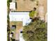 Overhead perspective of the property featuring the unique metal roof design and surrounding grassy yard at 3823 N 56Th St, Tampa, FL 33619
