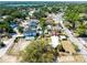 A vibrant aerial shot showcasing the property's location in a lush, green neighborhood with nearby lake access at 3823 N 56Th St, Tampa, FL 33619