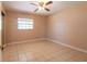 Bedroom with tile flooring and a ceiling fan at 3823 N 56Th St, Tampa, FL 33619