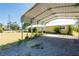 Carport with a view of the home and surrounding yard at 3823 N 56Th St, Tampa, FL 33619