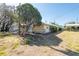 Well-maintained front yard with shade trees and lush landscaping at 3823 N 56Th St, Tampa, FL 33619
