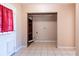 Laundry room with tile flooring and built-in shelving at 3823 N 56Th St, Tampa, FL 33619