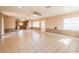 Bright, open-concept living space with tile floors and a view to the kitchen at 3823 N 56Th St, Tampa, FL 33619