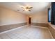 Living room featuring tile flooring and two-tone walls at 3823 N 56Th St, Tampa, FL 33619