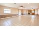 Spacious living room featuring neutral walls, tile flooring, and recessed lighting at 3823 N 56Th St, Tampa, FL 33619