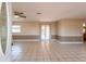 Bright living room with neutral walls, tile flooring, and natural light at 3823 N 56Th St, Tampa, FL 33619