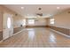 Spacious living room with tile flooring, recessed lighting, and a ceiling fan at 3823 N 56Th St, Tampa, FL 33619