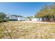 Large lot with a variety of outbuildings and a mix of grass and gravel at 3823 N 56Th St, Tampa, FL 33619