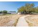 Spacious lot with mature trees and a long walkway at 3823 N 56Th St, Tampa, FL 33619